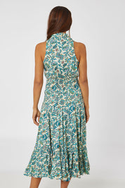 Model Cara wearing the Polly Cotton Dress in colour Siena (Blue), from the back