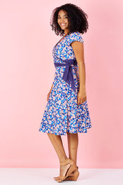 Model Grazi wearing size S of the Leela Cotton Wrap Dress in colour Sakura (Blue), from the front, showing the whole outfit