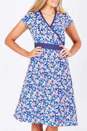 Model Maddy wearing size S of the Leela Cotton Wrap Dress in colour Sakura (Blue), from the front, showing the whole outfit