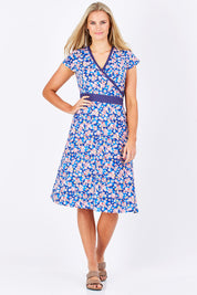 Model Maddy wearing size S of the Leela Cotton Wrap Dress in colour Sakura (Blue), from the front, showing the whole outfit