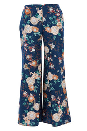 Product shot of the Sarita Pant in colour Maya (Blue), from the back