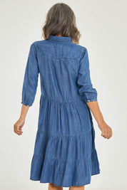 Model Luisa wearing size 10 of the Aubree Dress in colour Blue (Blue), from the back
