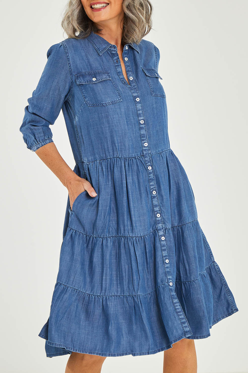 Model Luisa wearing size 10 of the Aubree Dress in colour Blue (Blue), from the front, cropped image