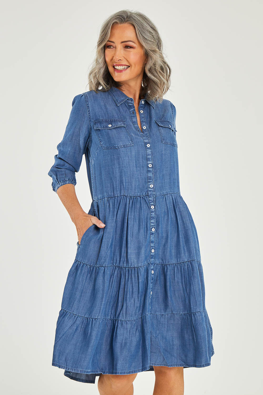 Model Luisa wearing size 10 of the Aubree Dress in colour Blue (Blue), from the front, cropped image