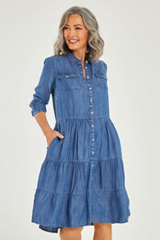 Model Luisa wearing size 10 of the Aubree Dress in colour Blue (Blue), from the front, cropped image