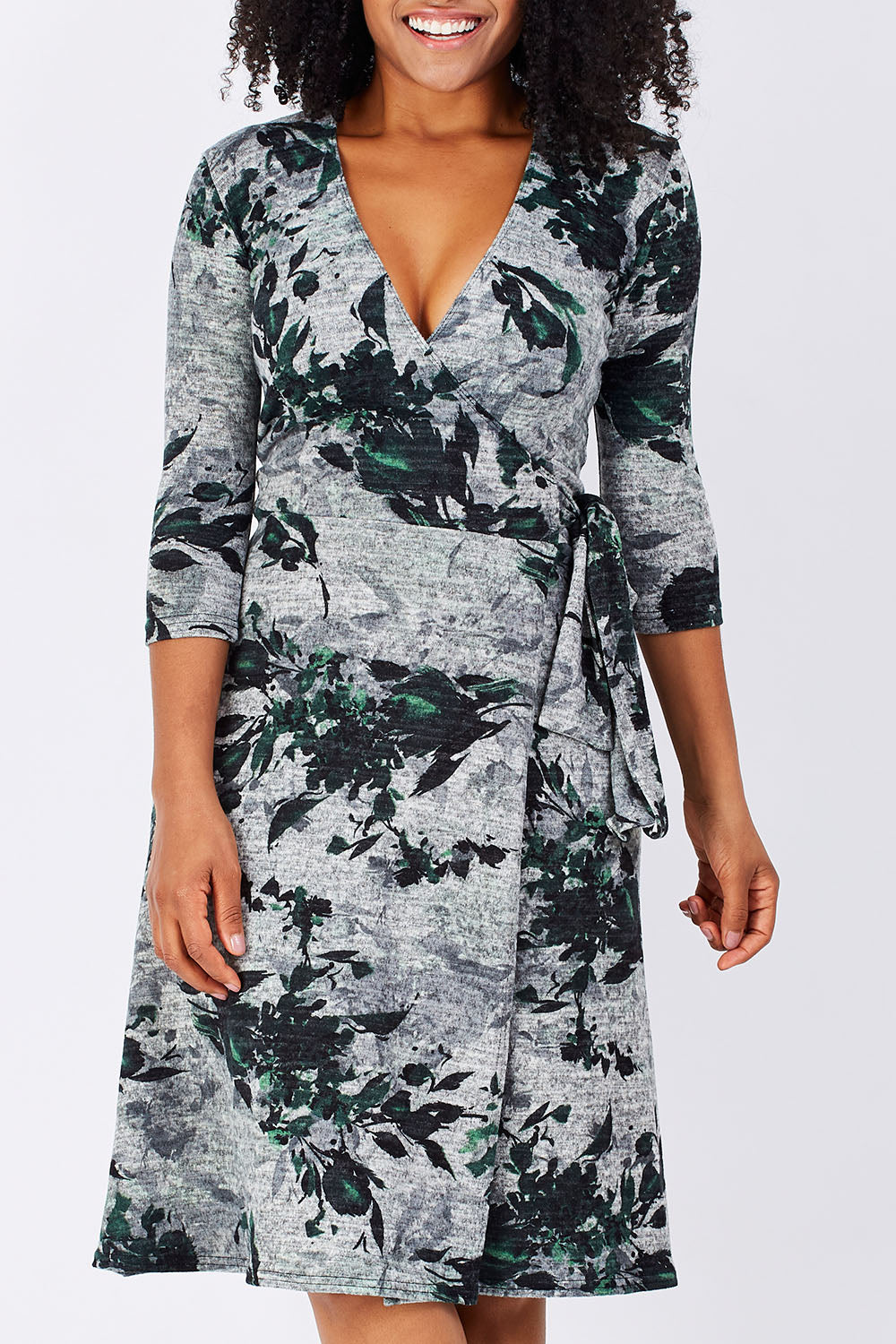 Model Grazi wearing size S of the Betty Wrap Dress in colour Print (Black), from the front, cropped image