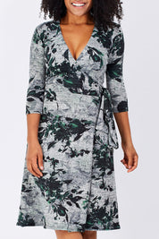 Model Grazi wearing size S of the Betty Wrap Dress in colour Print (Black), from the front, cropped image