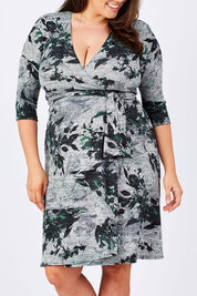 Model Mae wearing size XL of the Betty Wrap Dress in colour Print (Black), from the front, cropped image