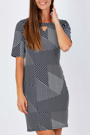 Model Anna wearing size S of the Laney Shift Dress in colour Navy (Blue), from the front, cropped image