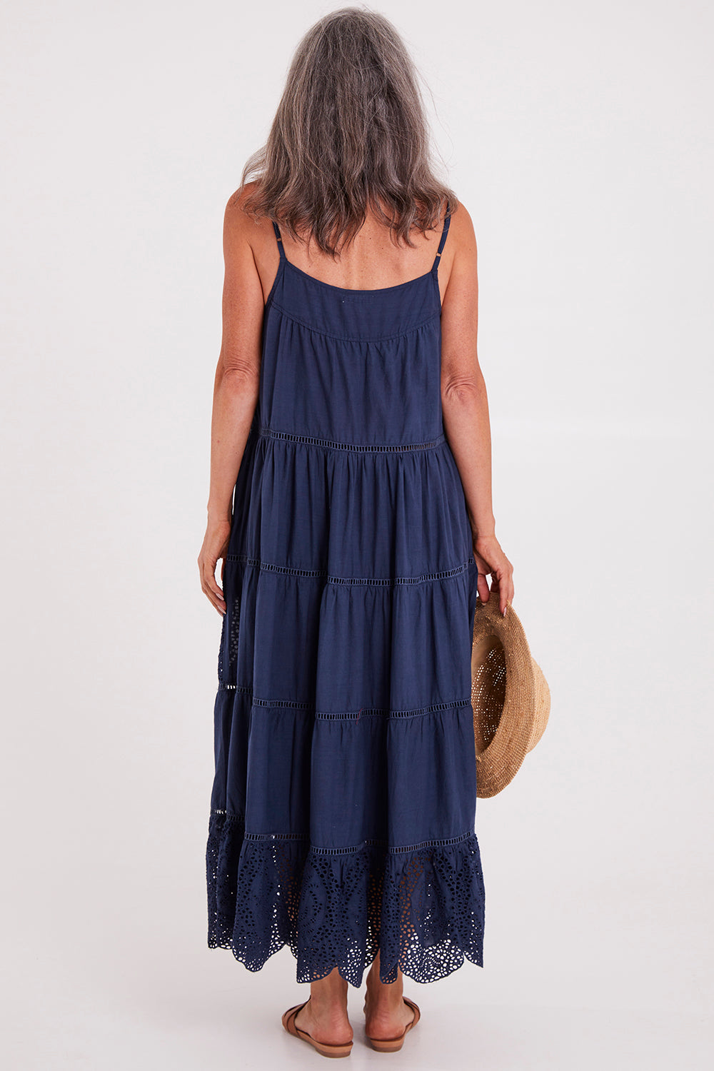 Model Luisa wearing size S of the Carly Maxi in colour Navy (Blue), from the back