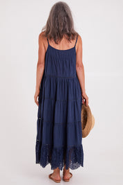 Model Luisa wearing size S of the Carly Maxi in colour Navy (Blue), from the back