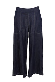Product shot of the Pula Pant in colour Denim (Blue), from the front
