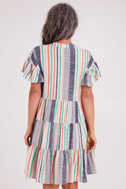 Model Luisa wearing size S of the Sway Dress in colour Multi (Blue), from the back