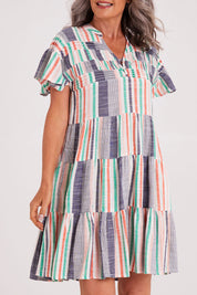 Model Luisa wearing size S of the Sway Dress in colour Multi (Blue), from the front, cropped image