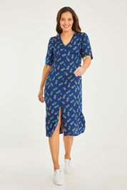 Model Georgia wearing size 10 of the Frenchie Dress in colour Pinapples (Blue), from the front, showing the whole outfit