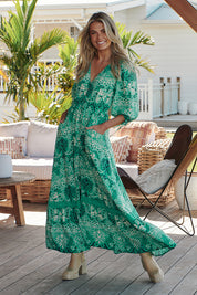 A model wearing the Koda Print Molli Maxi in colour Kodaprint (Green), from the front, showing the whole outfit