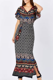 Model Anna wearing size 10 of the Villia Lina Maxi in colour BorderPrnt (Grey), from the front, cropped image