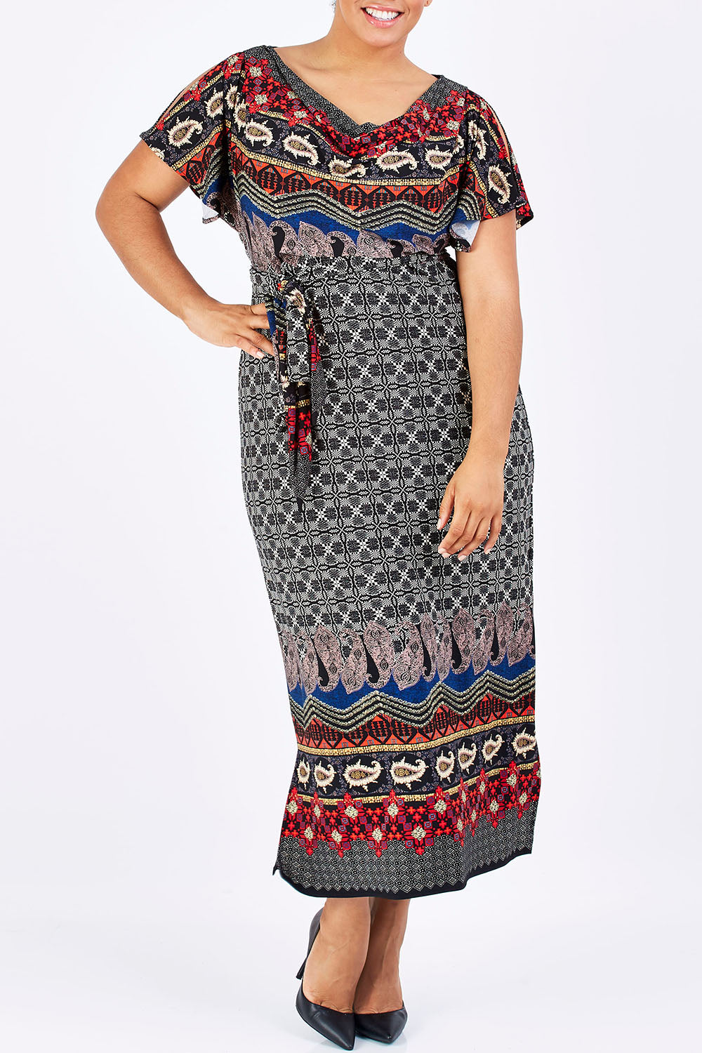 Model Shareefa wearing size 18 of the Villia Lina Maxi in colour BorderPrnt (Grey), from the front, cropped image