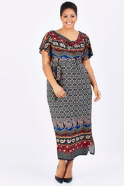 Model Shareefa wearing size 18 of the Villia Lina Maxi in colour BorderPrnt (Grey), from the front, showing the whole outfit