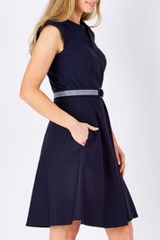 Model Maddy wearing size 10 of the Fit & Flare Belted Dress in colour Navy (Blue), from the front, cropped image