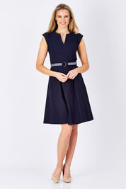 Model Maddy wearing size 10 of the Fit & Flare Belted Dress in colour Navy (Blue), from the front, showing the whole outfit