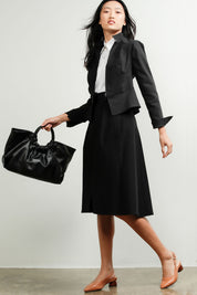 A model wearing the Front Zip Peplum Jacket in colour Black (Black), from the front, showing the whole outfit
