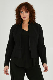 Model Maddy wearing size 16 of the Front Zip Peplum Jacket in colour Black (Black), from the front, cropped image