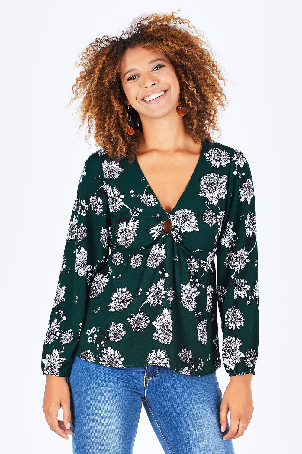 Model Summer wearing size 10 of the Magnolia Fields Keyhole Blouse in colour Magnolia (Green), from the front, cropped image