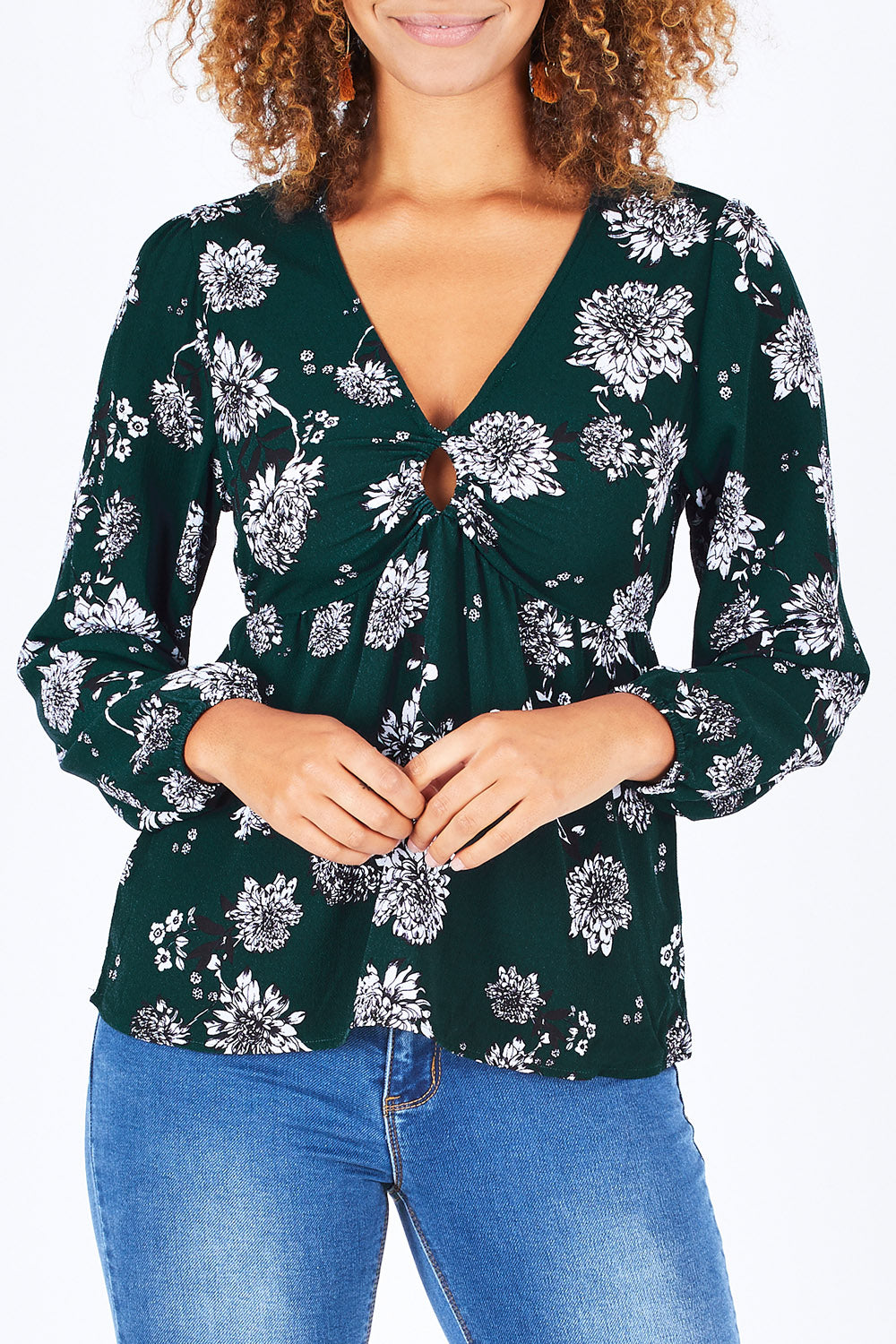 Model Summer wearing size 10 of the Magnolia Fields Keyhole Blouse in colour Magnolia (Green), from the front, cropped image
