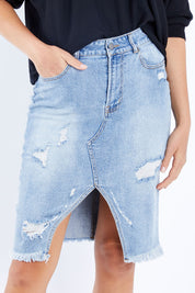 Model Madeline wearing size 10 of the Maxie Skirt in colour Indigowash (Blue), from the front, cropped image
