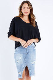Model Madeline wearing size 10 of the Maxie Skirt in colour Indigowash (Blue), from the front, cropped image