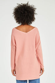 Model Olivia wearing size 10 of the Amanda Knit in colour Candy (Pink), from the back