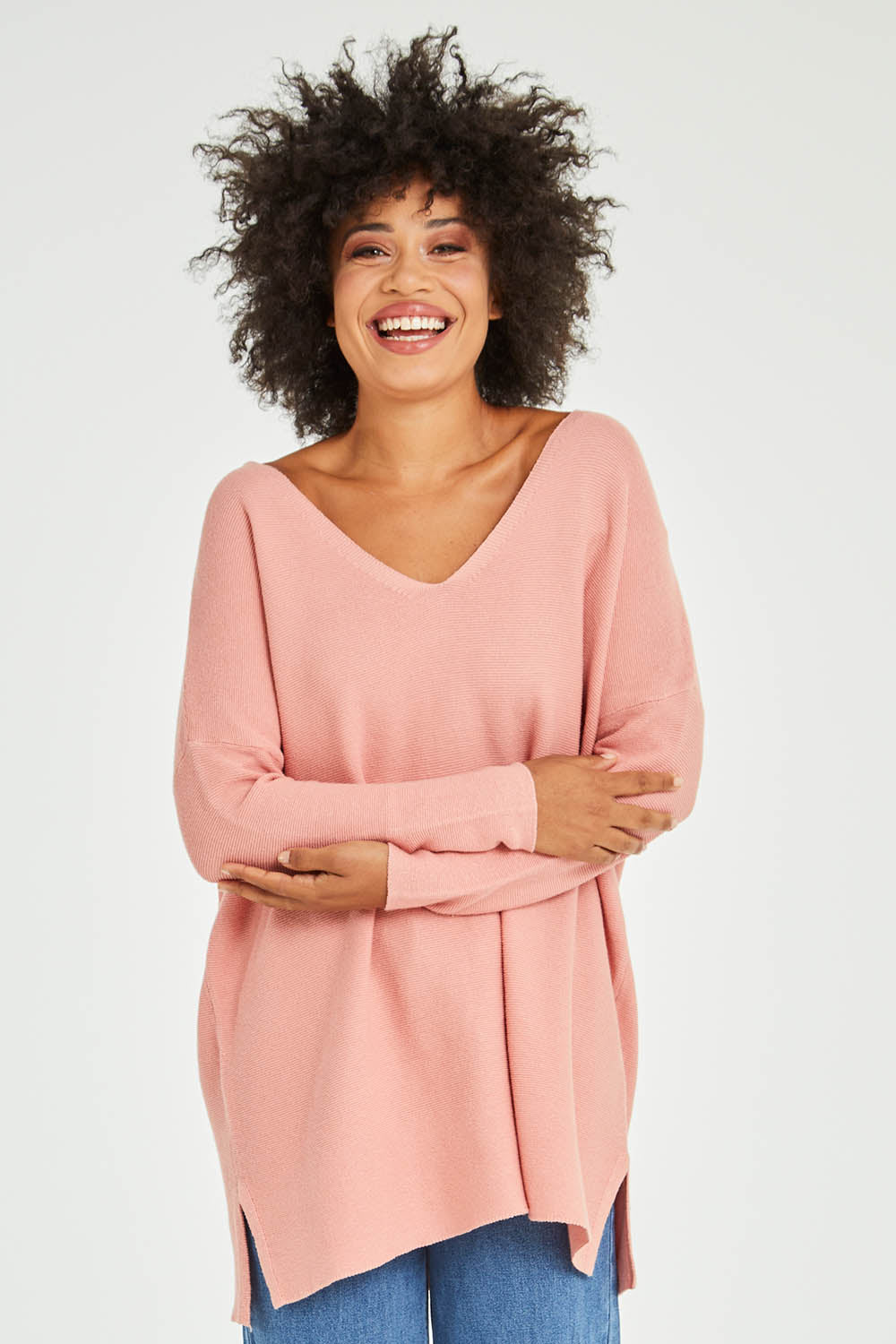 Model Olivia wearing size 10 of the Amanda Knit in colour Candy (Pink), from the front, cropped image