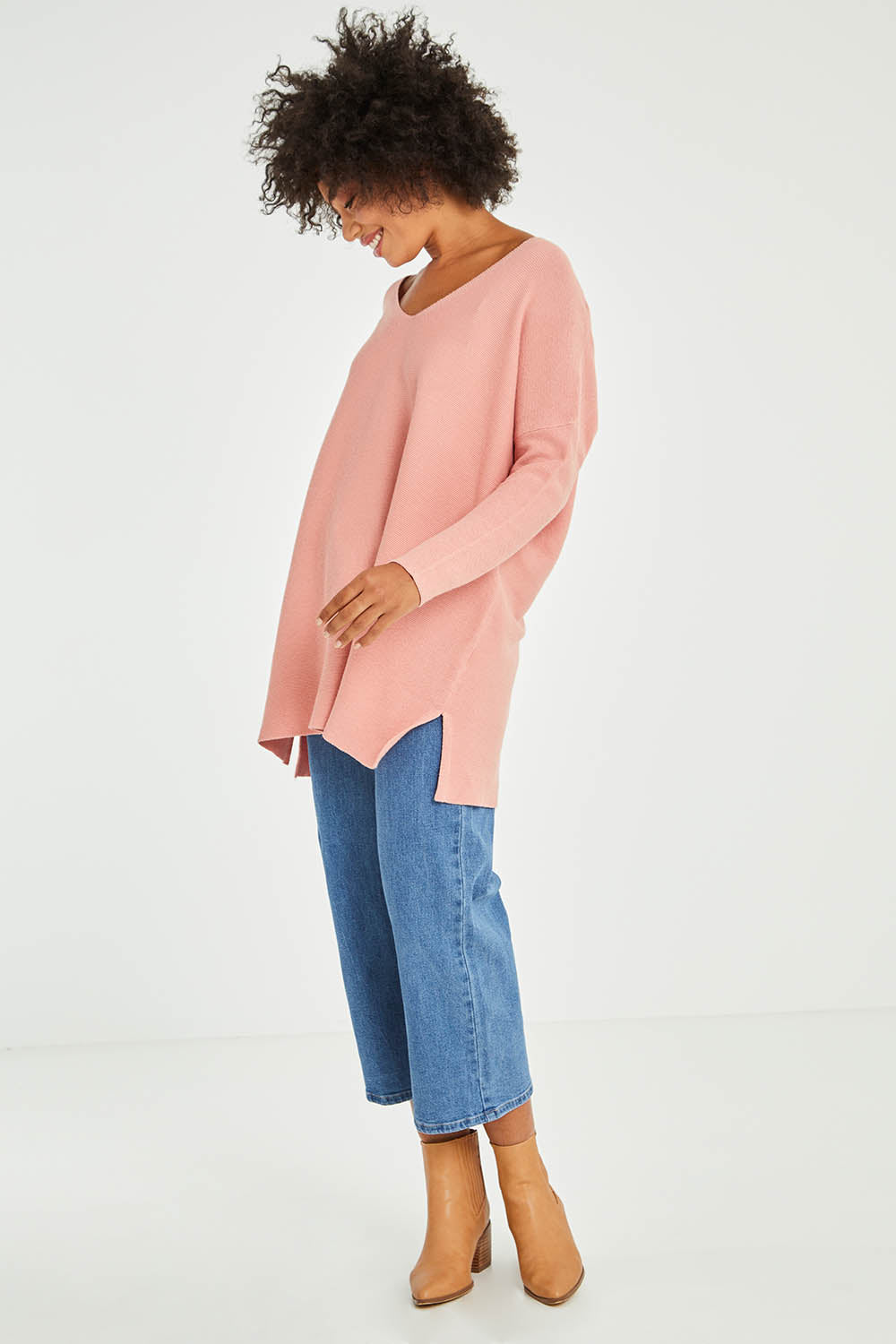 Model Olivia wearing size 10 of the Amanda Knit in colour Candy (Pink), from the front, showing the whole outfit
