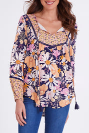 Model Madeline wearing size 10 of the Montana Boho Blouse in colour Navyfloral (Blue), from the front, cropped image