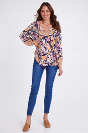 Model Madeline wearing size 10 of the Montana Boho Blouse in colour Navyfloral (Blue), from the front, showing the whole outfit