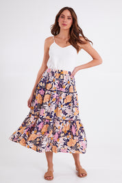 Model Madeline wearing size 10 of the Montana Tiered Skirt in colour Navyfloral (Blue), from the front, showing the whole outfit