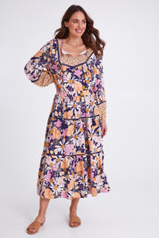 Model Madeline wearing size 10 of the Montana Tiered Skirt in colour Navyfloral (Blue), from the front, showing the whole outfit