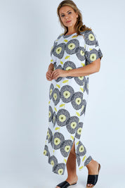Model Fiona wearing size 16 of the Helg Tee Dress in colour Dotflwr, from the front, showing the whole outfit
