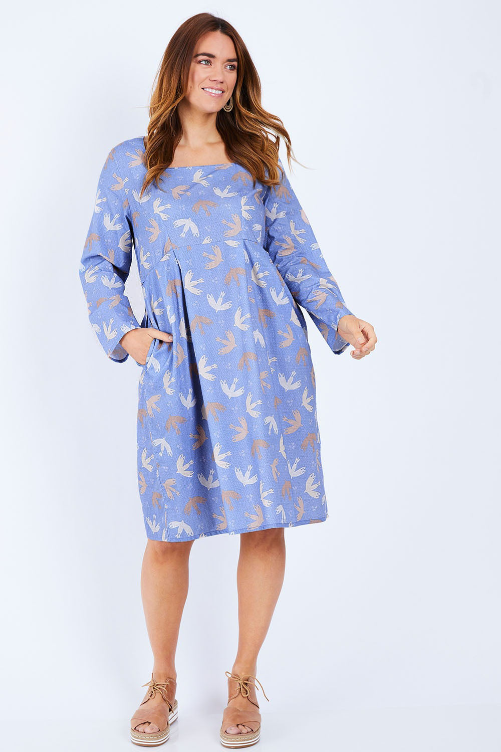 Model Laura wearing size 14 of the Naktergal Dress in colour Nightingal (Blue), from the front, showing the whole outfit