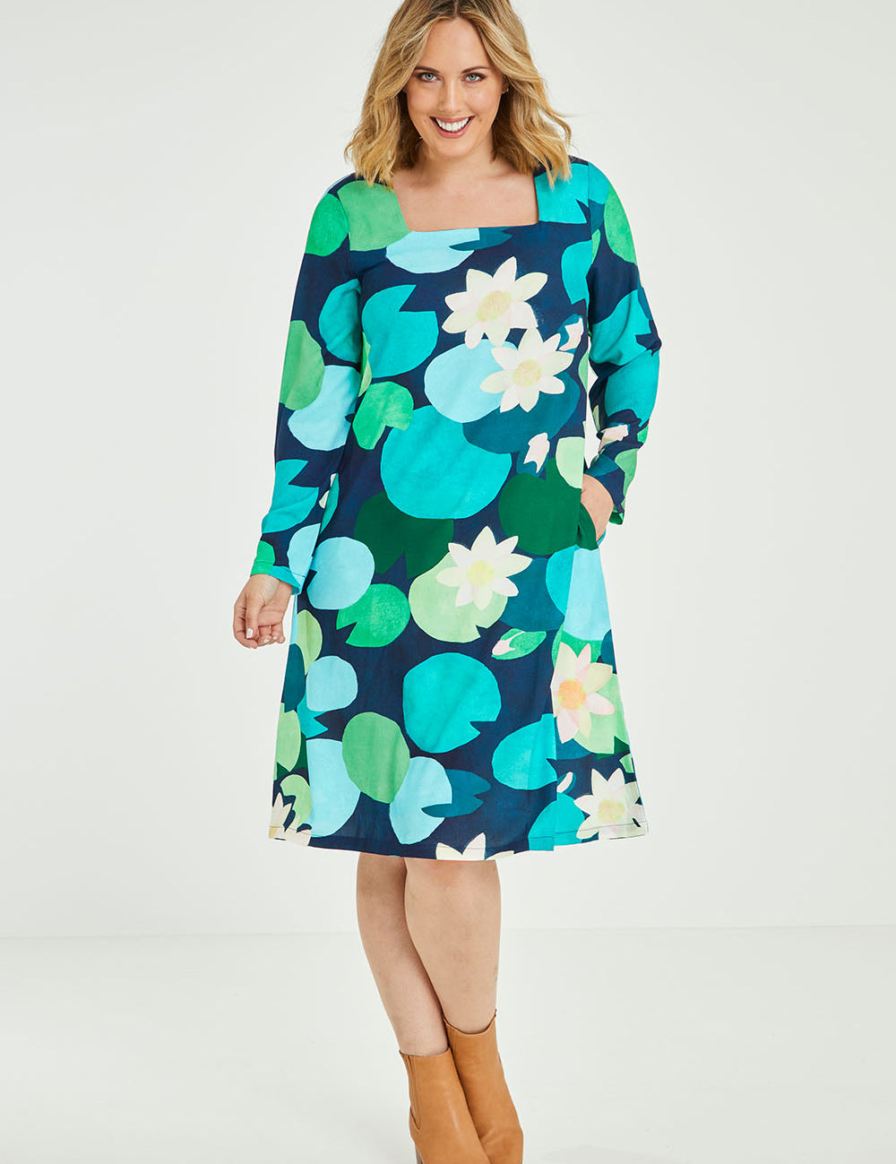 Model Jess wearing size 14 of the Foralskad Dress in colour Lilyblue (Blue), from the front, showing the whole outfit