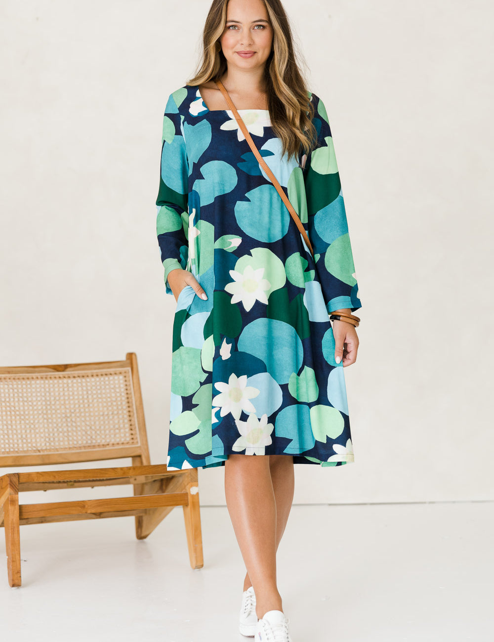 Model Tahlia wearing size 10 of the Foralskad Dress in colour Lilyblue (Blue), from the front, showing the whole outfit