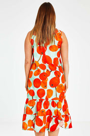 Model Laura wearing size 14 of the Svangande Dress in colour Redberry (Red), from the back