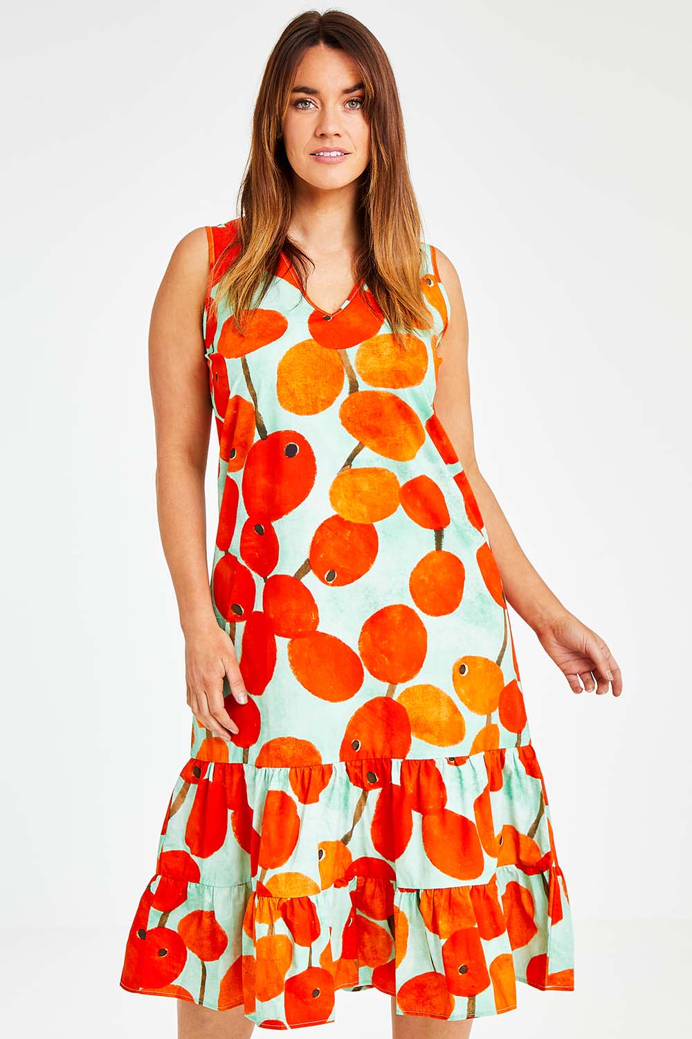 Model Laura wearing size 14 of the Svangande Dress in colour Redberry (Red), from the front, cropped image