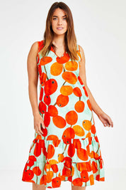 Model Laura wearing size 14 of the Svangande Dress in colour Redberry (Red), from the front, cropped image