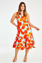 Model Laura wearing size 14 of the Svangande Dress in colour Redberry (Red), from the front, showing the whole outfit