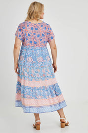 Model Keeara wearing size 16 of the Manly Beach Midi Dress in colour Coralblue (Blue), from the back