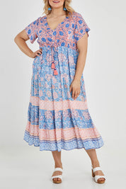 Model Keeara wearing size 16 of the Manly Beach Midi Dress in colour Coralblue (Blue), from the front, cropped image