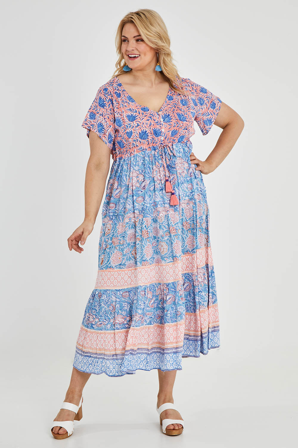 Model Keeara wearing size 16 of the Manly Beach Midi Dress in colour Coralblue (Blue), from the front, showing the whole outfit
