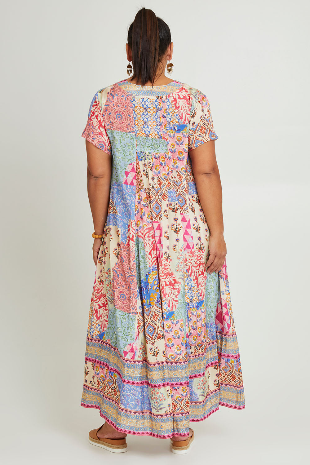 Model Ashleigh wearing size 16 of the Mindil Beach Maxi Dress in colour Patchwork, from the back